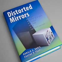 Distorted Mirrors book on gray tabletop